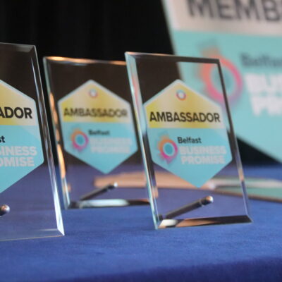 Image shows belfast business promise ambassador plaques which are glass with a blue and gold logo