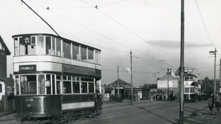 Moffett 328 and an identified McCreary taken at Ardoyne in the late 1940s. The overhead wires in the centre of the picture are leading to Ardoyne depot. The bus stop on the right belongs to the Northern Ireland Road Transport Board (NIRTB) which was succeeded by the Ulster Transport Authority (UTA) in 1948. [credit: J.H. Price]