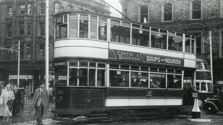 370 in Donegall Square West about to make the right-hand turn into Donegall Square West bound for Ballygomartin, the last tram route to open in Belfast. The destination blind in the lower saloon window shows 