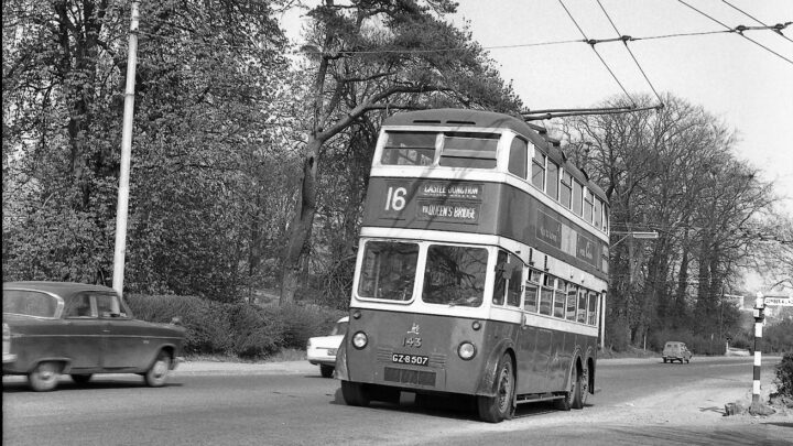When the Dundonald route was opened in 1942 the trolleybus terminus was at the Elk Inn located at the junction of the Upper Newtownards and Comber Roads. The terminus was anti clockwise and very tight. Guy 143 is heading back to the city centre. The date of the photograph is April 1962, and the scene is unrecognisable today. [credit: Richard Whitford]