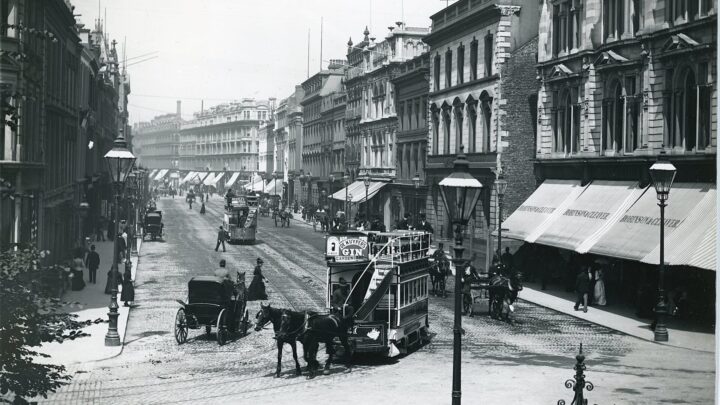 Horse tram No 27 about to turn right from Donegall Place to Donegall Square North en route to Botanic Gardens. The picture was taken before 1890 as the fourth bay has yet to be added to Robinson and Cleaver's department store. The Store relocated here in 1887 from Castle Place. The store closed in 1984 and the building converted to individual shops and offices. [credit: National Library of Ireland]